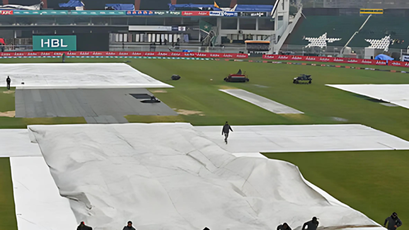 Umpires checking the pitch under covers during rain delay at Rawalpindi.