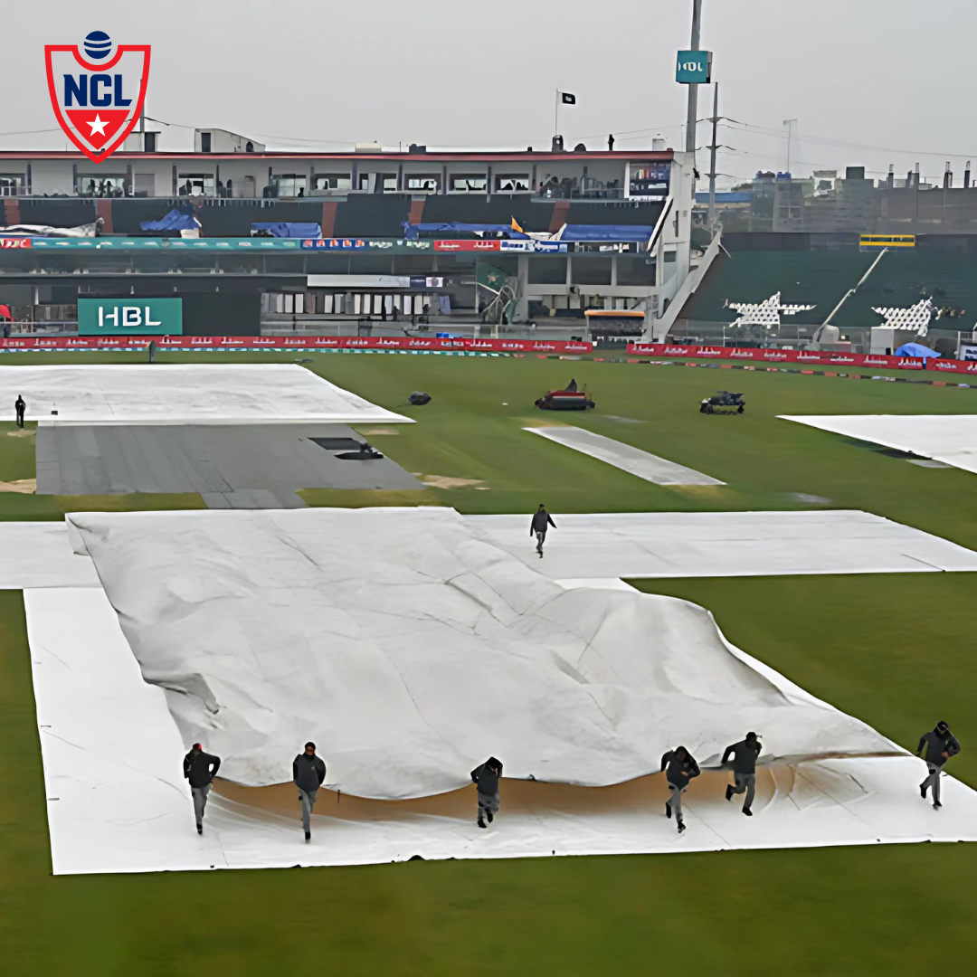 Umpires checking the pitch under covers during rain delay at Rawalpindi.