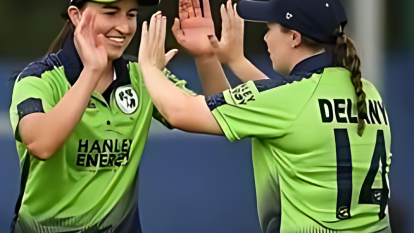 Ireland cricketers Orla Prendergast and Leah Paul celebrate a win on the field.