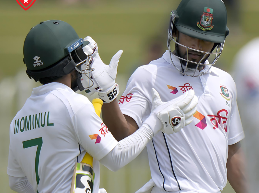 Najmul Hossain Shanto and Mominul Haque celebrating on the cricket field.