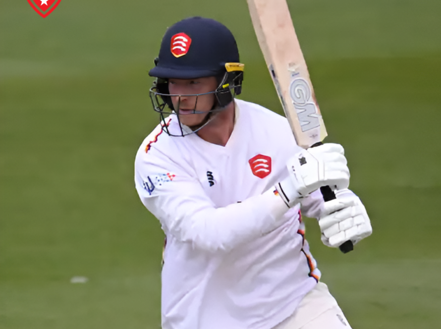 Tom Westley raising his bat after scoring a century in the County Championship.