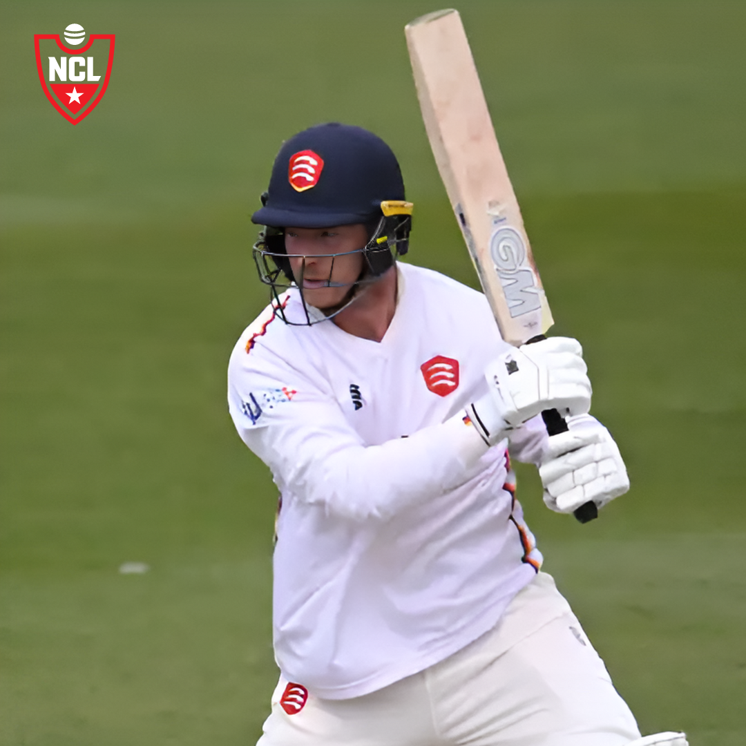 Tom Westley raising his bat after scoring a century in the County Championship.